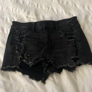 Black (with rips) American Eagle- next level stretch Jean Shorts.